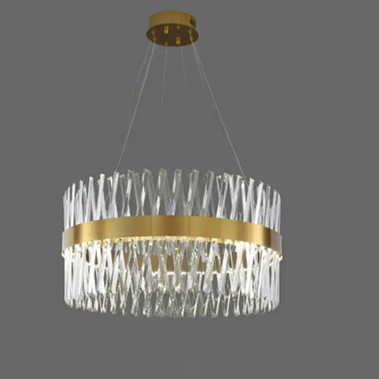 A modern gold finish pendant light with geometric k9 crystal prisms and circular fixture width for bedroom use