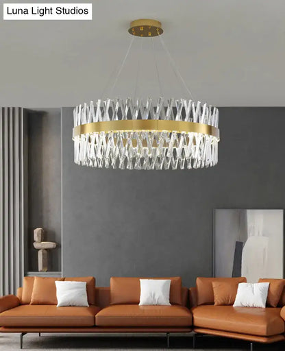 A modern circular pendant light with gold finish and k9 crystal geometric design for bedroom fixture width