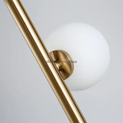 Postmodern gold-toned metal glass ball standing lamp with frosted white globe and circular base for living room decorbites glass ball
