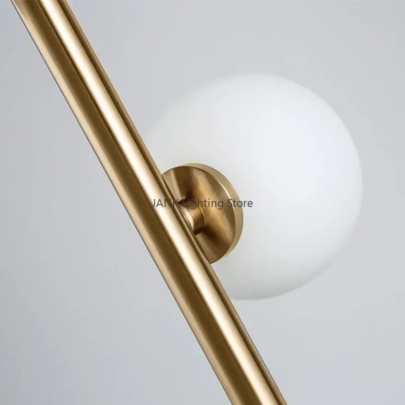 Postmodern gold-toned metal glass ball standing lamp with frosted white globe and circular base for living room decorbites glass ball