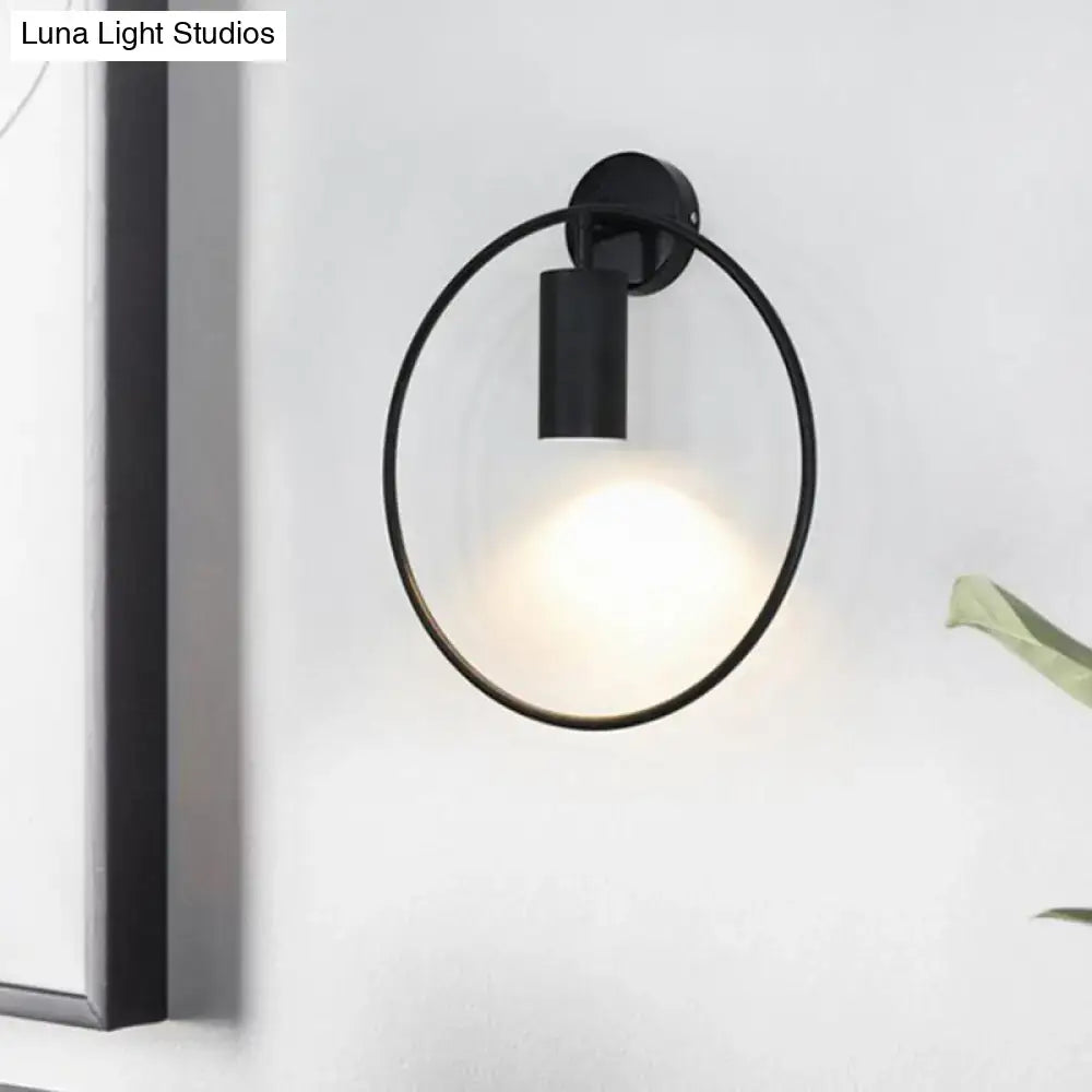 Black minimalist postmodern gold halo ring wall sconce with circular frame and 16 inches fixture height for bedroom