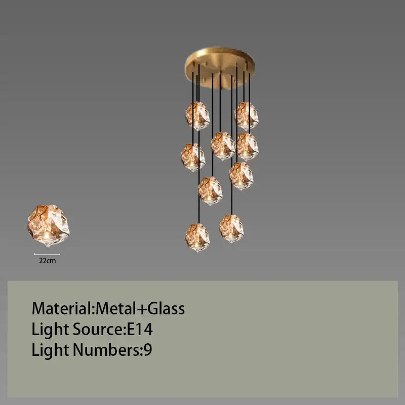 Postmodern gold-toned metal and glass led chandelier with nine amber faceted globes for dining room light