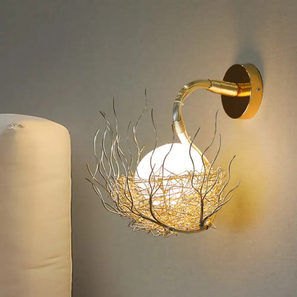 Postmodern gold-toned globe glass wall light fixture with sculptural wire nest design for bedroom sconce wall light