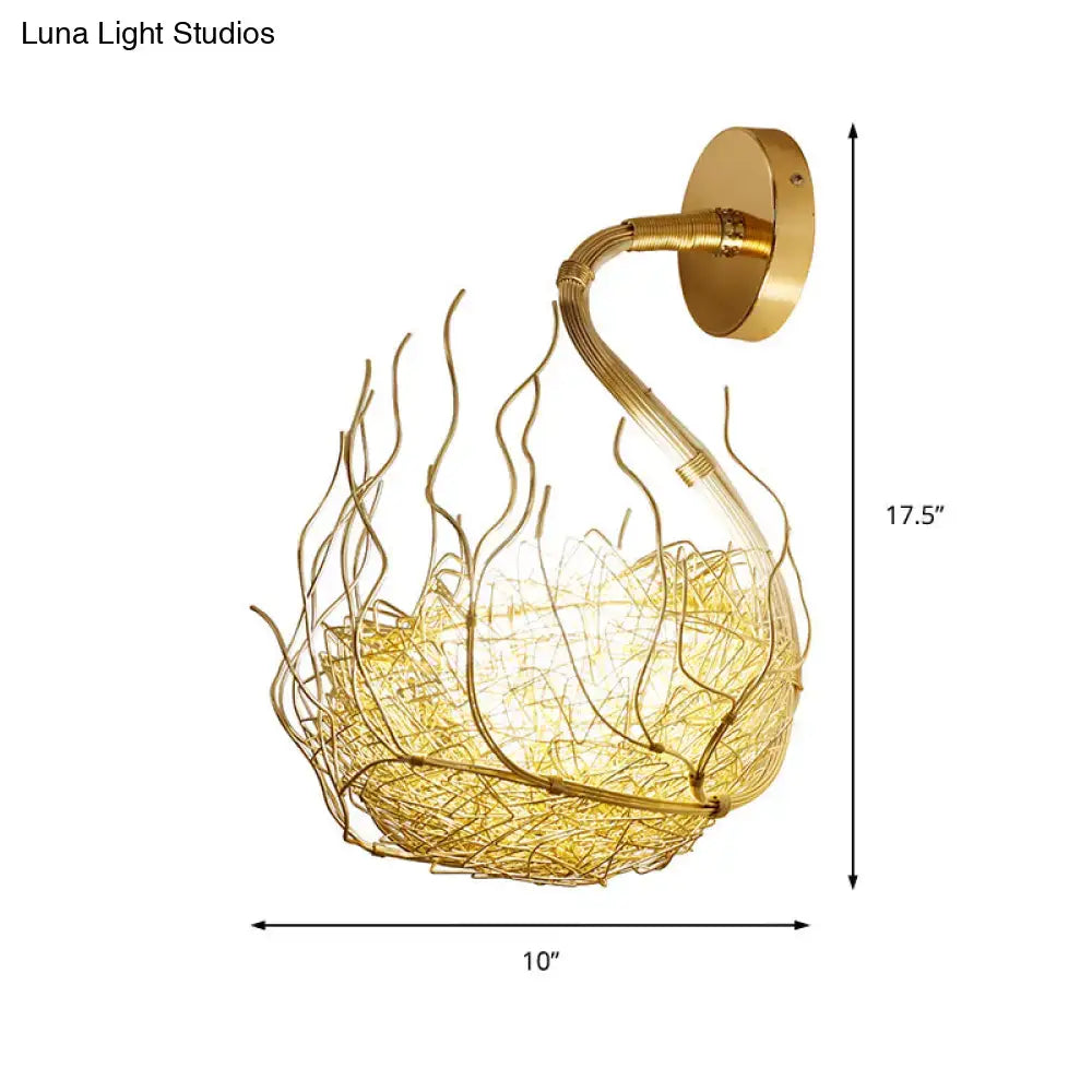 Postmodern gold-toned wire nest globe glass wall light fixture with curved arm and woven design for bedroom sconce