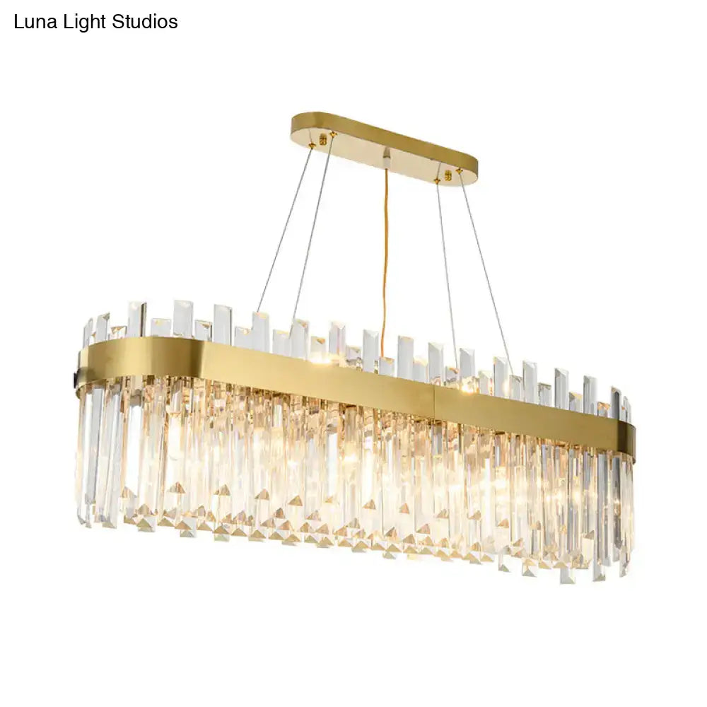 Postmodern gold oval island lighting fixture with clear crystal prisms and sleek metallic frame for 110v-120v use