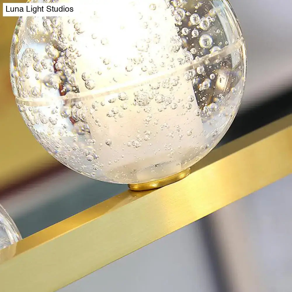 Decorbites postmodern seeded crystal suspension globe light with clear glass bubbles and gold toned base for dining rooms