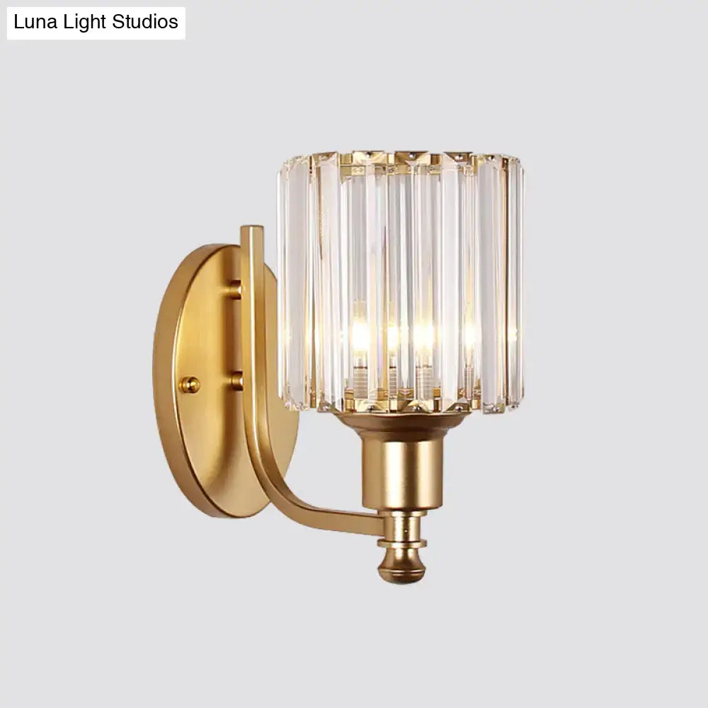 Postmodern gold wall lamp with prismatic crystal shade featuring vertical faceted glass rods for bedroom sconce