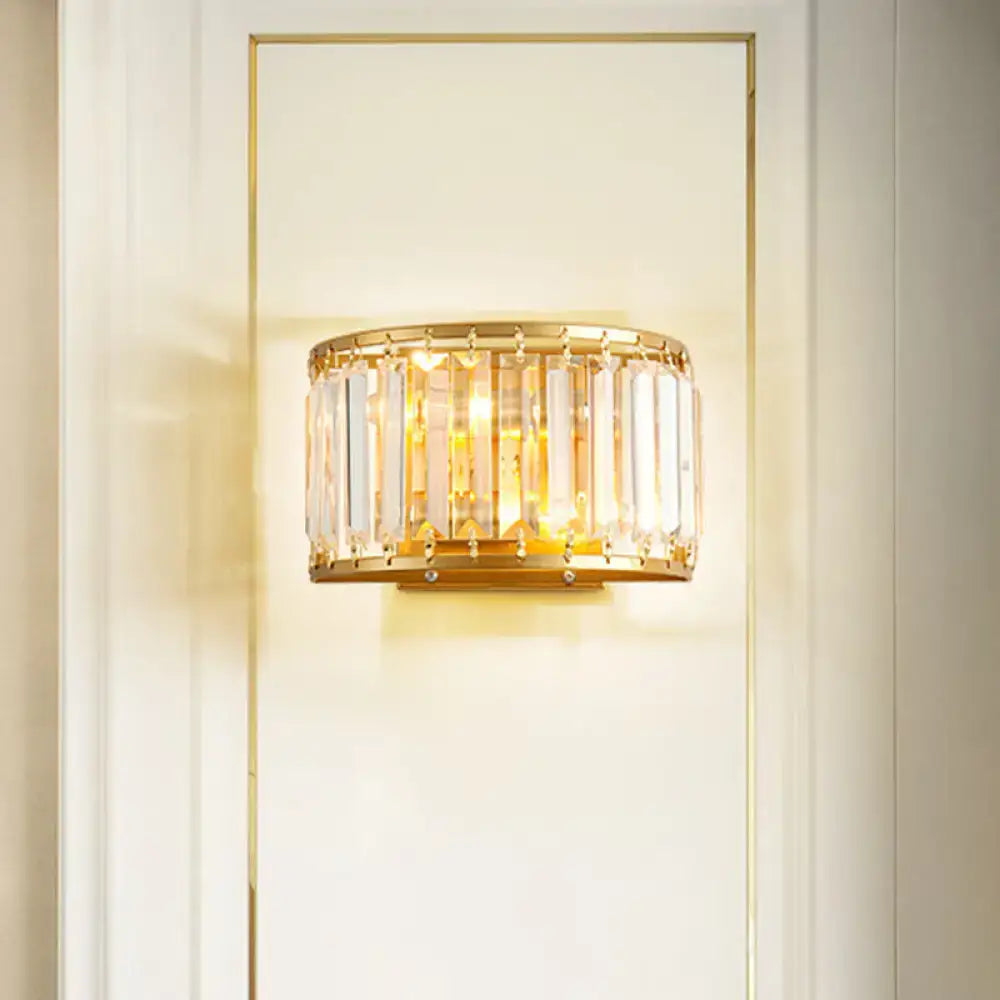 Postmodern gold wall lamp with prismatic crystal shade featuring vertical crystal rods for bedroom sconce lighting