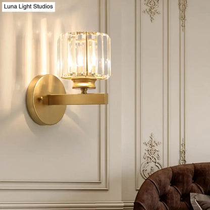 Postmodern gold wall lamp with prismatic crystal shade featuring a faceted crystal glass bedroom sconce