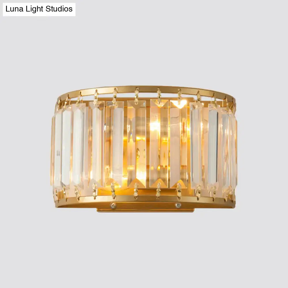 Postmodern gold wall lamp featuring a prismatic crystal shade with vertical and dangling crystal rods for bedroom use