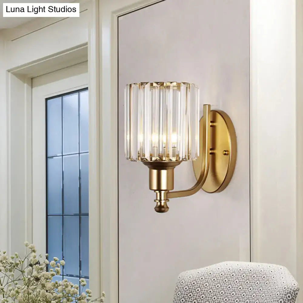 Postmodern gold wall lamp featuring vertical prismatic crystal shade designed as a bedroom sconce