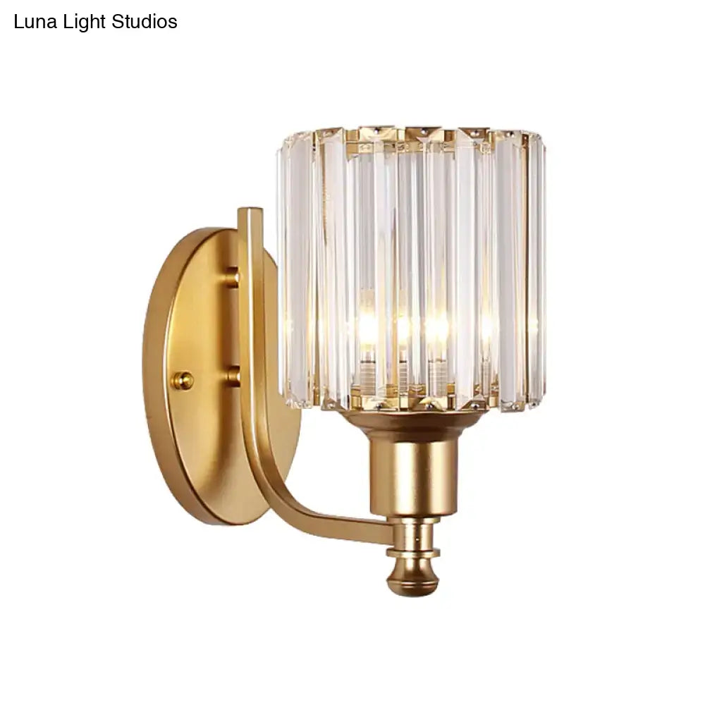 Postmodern gold wall lamp with a prismatic crystal shade composed of vertical panels for bedroom use