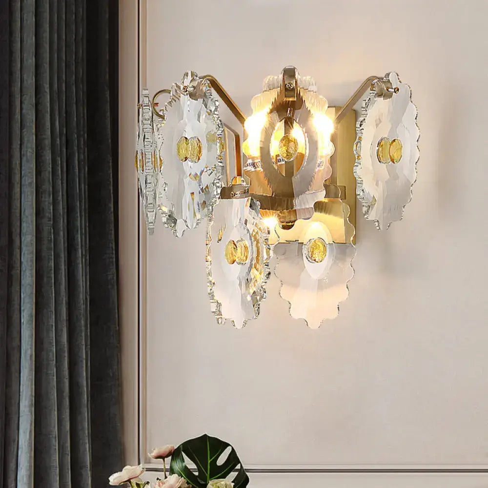 Elegant green gold gem wall sconce with translucent scalloped glass petals and amber accents, ideal bedroom light fixture