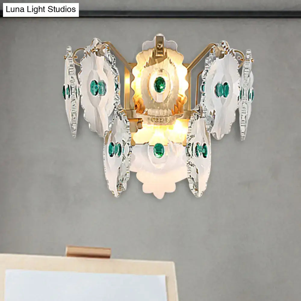 Postmodern green gold gem crystal wall sconce with white petals and gold-toned metal accents for bedroom lighting