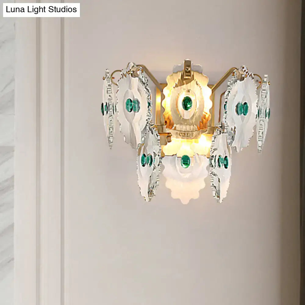 Elegant postmodern green gold gem crystal wall sconce with white scalloped glass and emerald accents, 10 inch fixture width