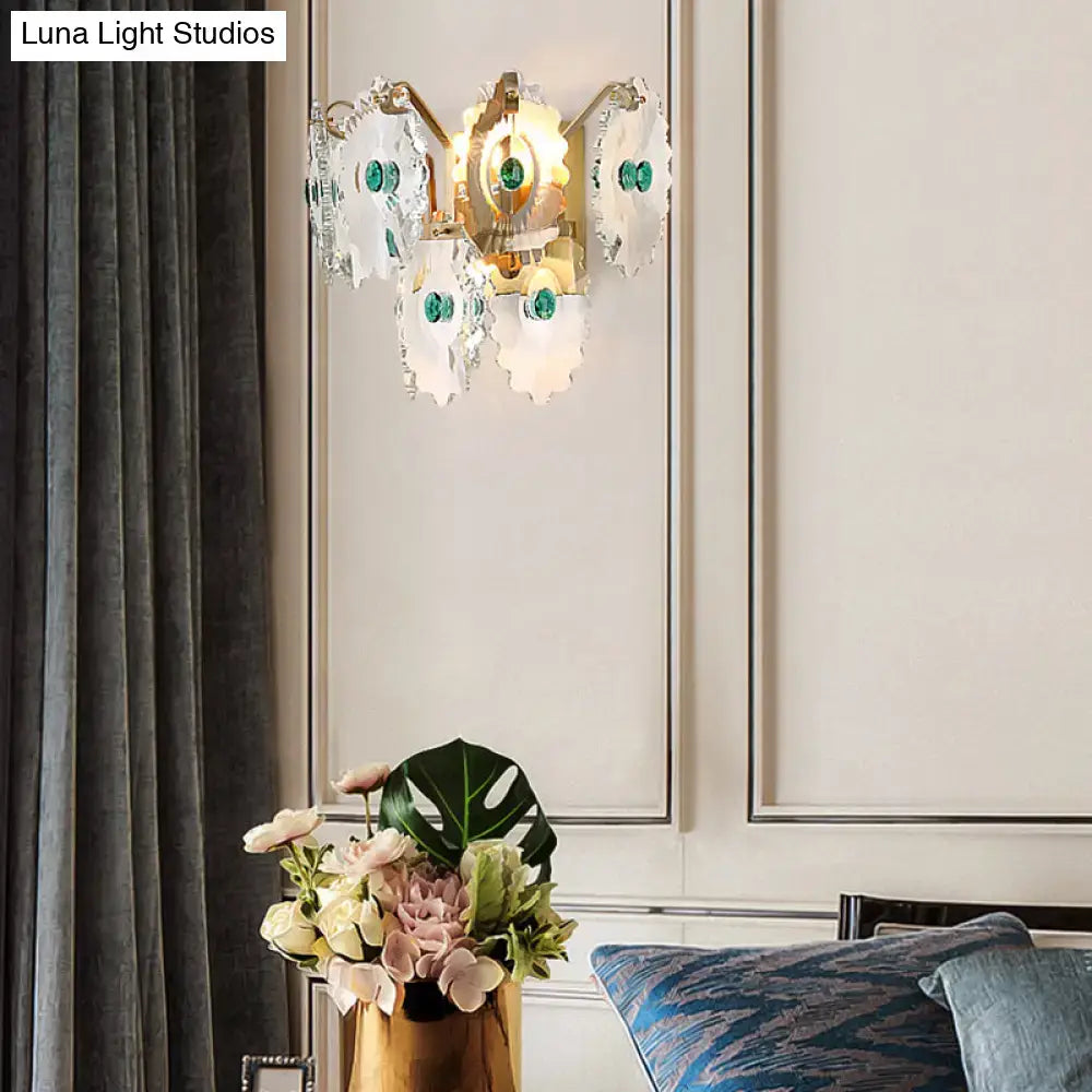 Postmodern green gold gem crystal wall sconce with gold-toned petals and emerald accents for bedroom lighting