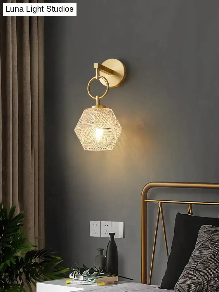 Gold-toned postmodern luxury led wall lamp with hexagonal crystal-encrusted glass shade for bedroom lighting