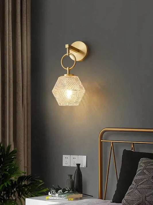 Gold-toned postmodern luxury led wall lamp with faceted crystal hexagonal shade for bedroom lighting