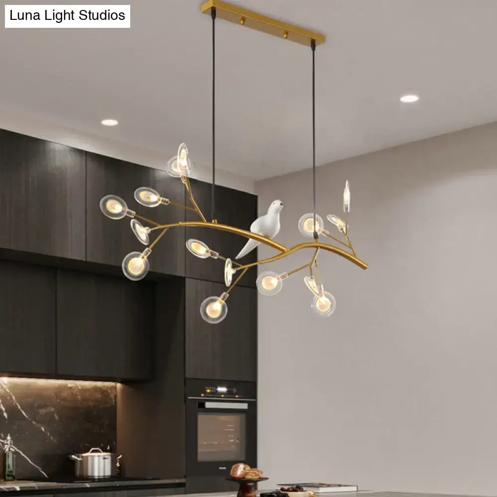 DecorBites postmodern metal island light with gold-toned branch design, clear globe bulbs, and white ceramic bird hanging lamp