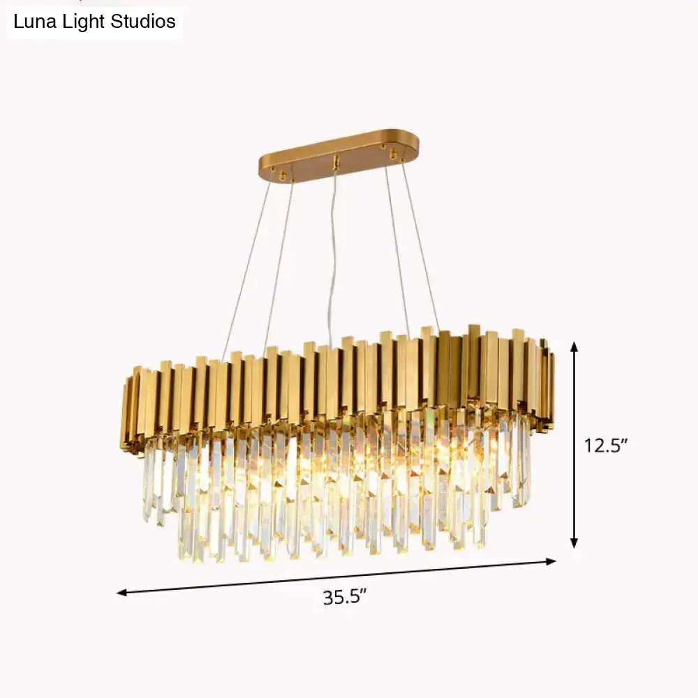 DecorBites gold postmodern oval hanging light with vertical metallic bars and cascading crystal prisms for dining room island