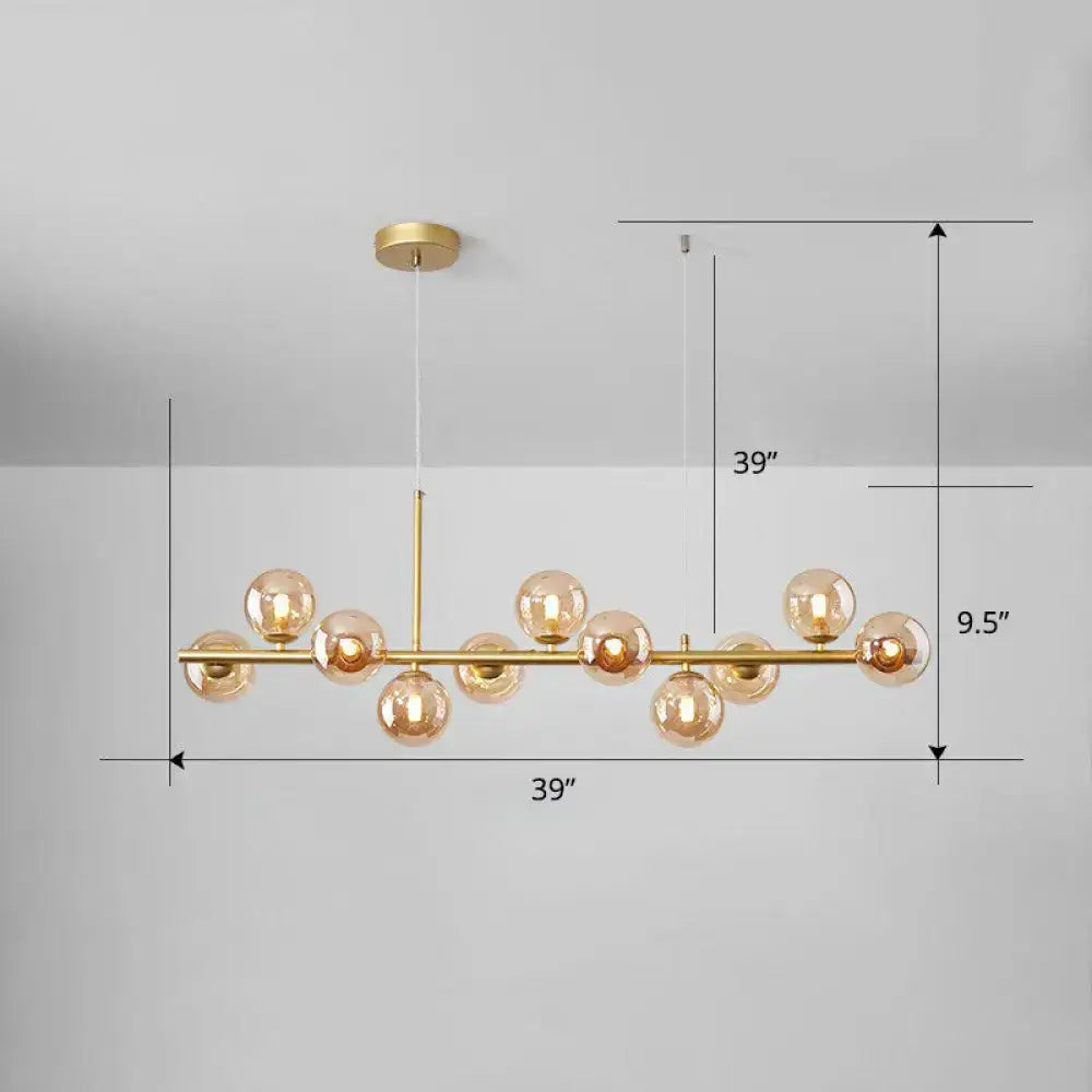 Gold-toned DecorBites™ LED island pendant light with amber glass globes in smoke grey cognac for dining room