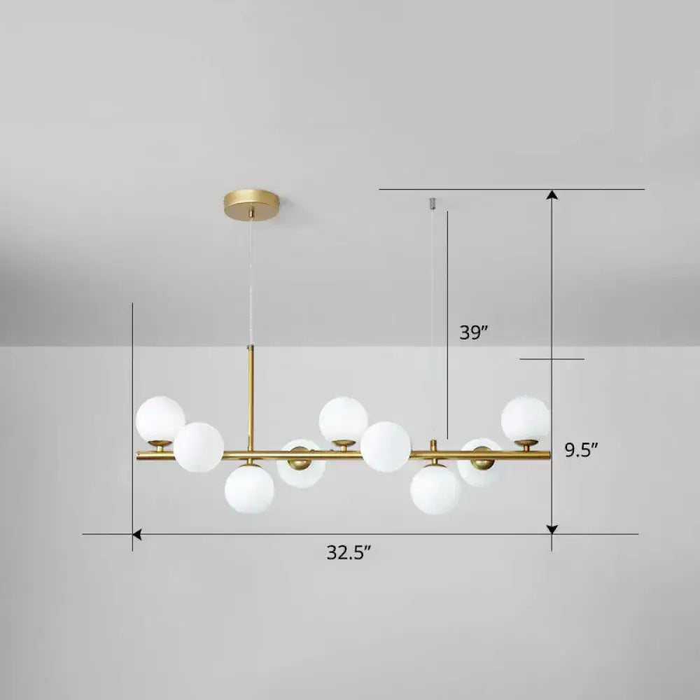 Gold-toned decorbites™ led island pendant light with white glass globes in clear smoke grey for dining rooms