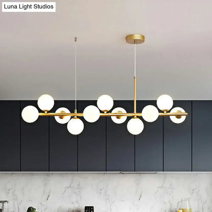 DecorBites™ LED island pendant light features modern gold-toned fixture with smoke grey cognac frosted glass globes