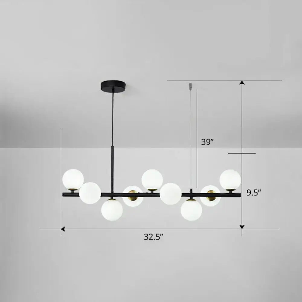 Modern black metal chandelier with frosted white glass globes for dining room featuring smoke grey cognac accents