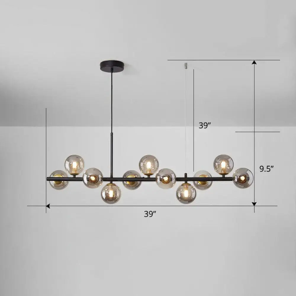 Modern black metal chandelier with multiple amber-tinted glass globes in smoke grey cognac for dining room lighting
