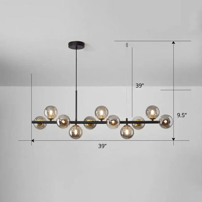 Modern black metal chandelier with multiple amber-tinted glass globes in smoke grey cognac for dining room lighting