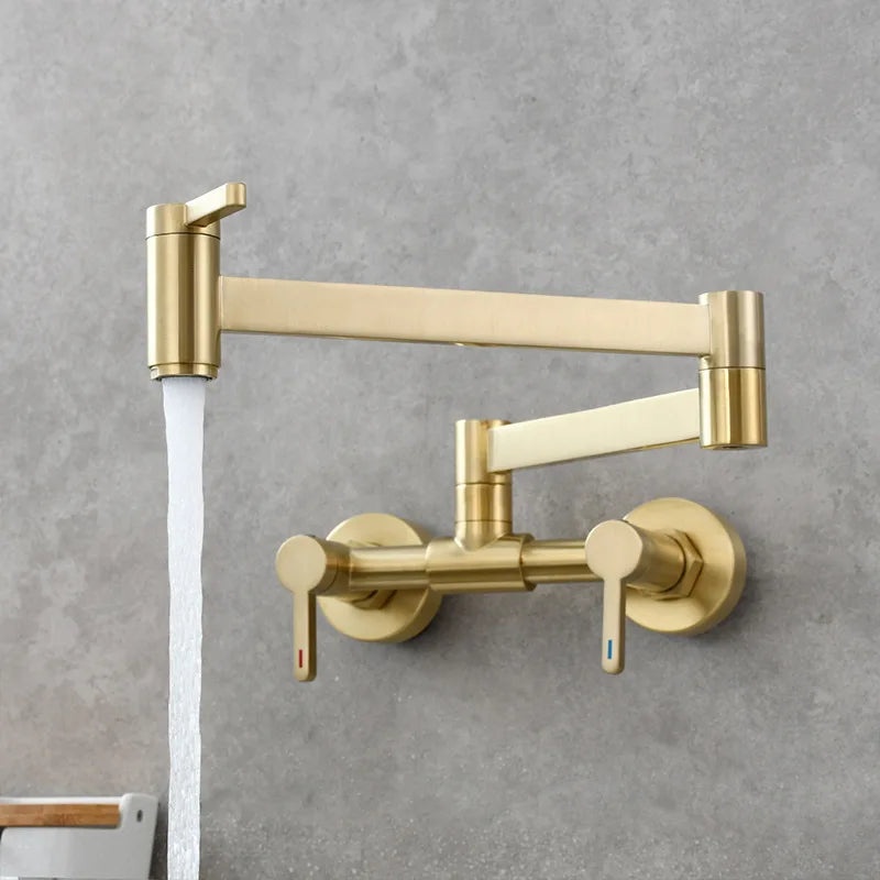 Gold-colored wall mounted single hole pot filler tap with extendable foldable spout and dual handle brass design