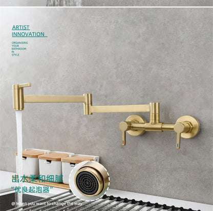 Gold-colored wall mounted single hole pot filler tap with extendable folding spout and dual handles in brushed brass
