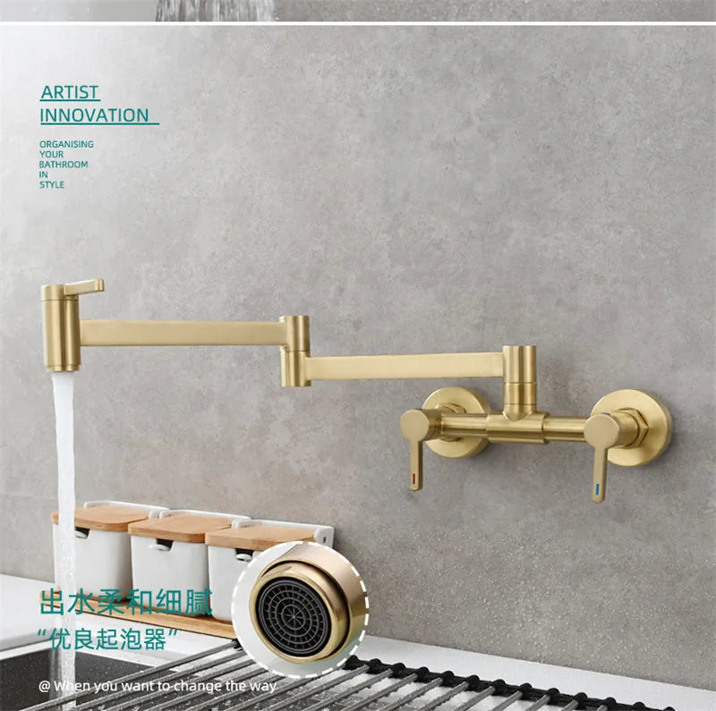 Gold-colored wall mounted single hole pot filler tap with extendable folding spout and dual handles in brushed brass