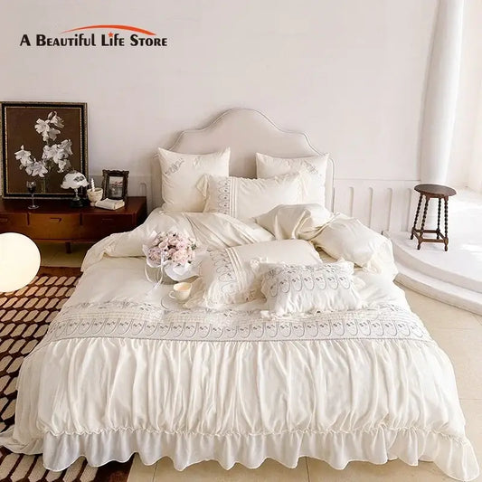 Cream-colored princess wedding bedding set with decorbites flowers embroidery and soft flowing fabric finish