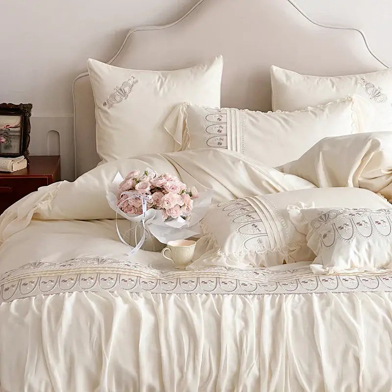 Cream-colored satin princess wedding bedding set with delicate decorbites flowers embroidery and ruffled edges