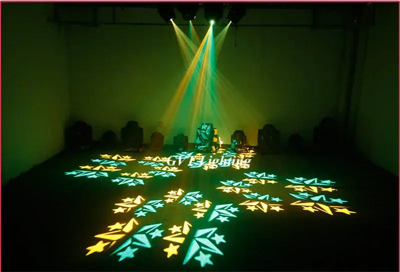 Professional black 120w led spot moving head light creating a vibrant green and yellow star pattern on a dark floor decorbites 120w led