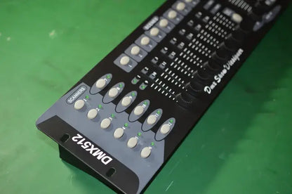 Professional black dmx controller stage with white knobs and illuminated green indicators for event room use
