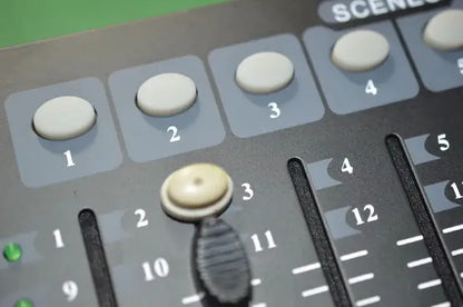 Professional black dmx controller stage lights console with white numbered knobs and central rotary encoder for events