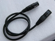 Professional black shielded dmx cable with two male connectors coiled on white foam for stage lighting use