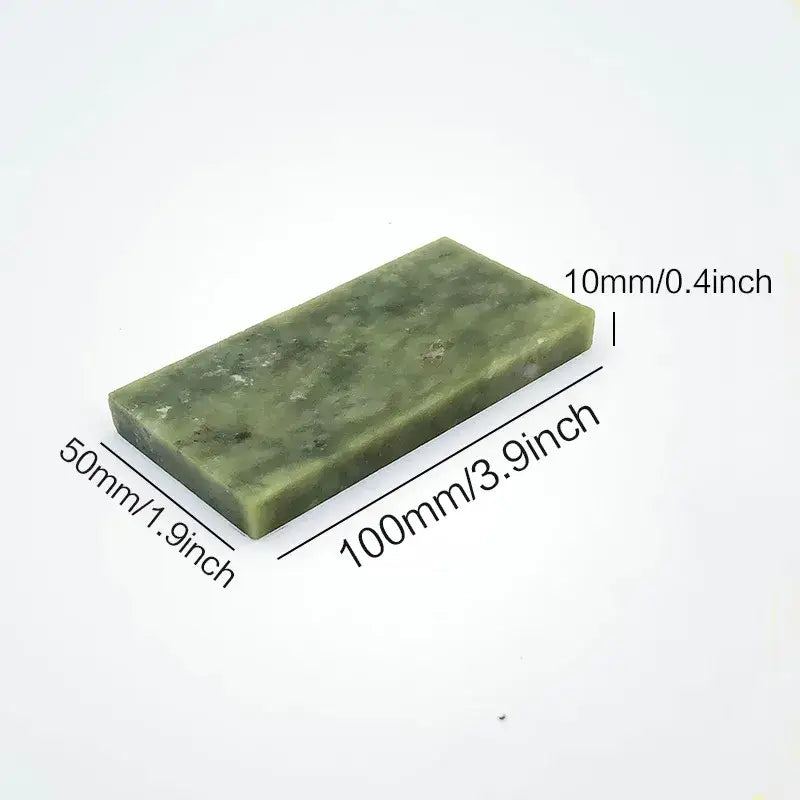 Professional green stone knife sharpener set featuring a polished rectangular jade honing block with natural veining