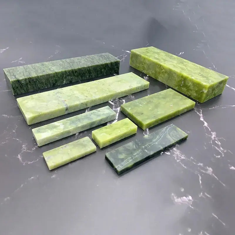 Set of seven green jade stone sharpener set with natural marbled patterns for professional kitchen honing block use