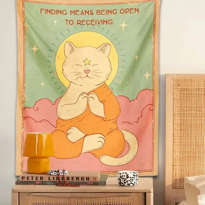 A soft pastel decorbites cat tapestry featuring an orange cat meditating with a yellow sun moon halo on mint green background