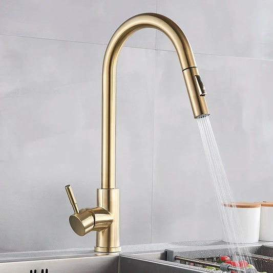 Brass-finished pull-down single hole kitchen mixer tap with sleek curved spout and single lever for hot water control