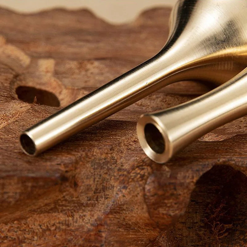 Two sleek brass-colored metal vases with a modern minimalist design and tapered shape for home decoration