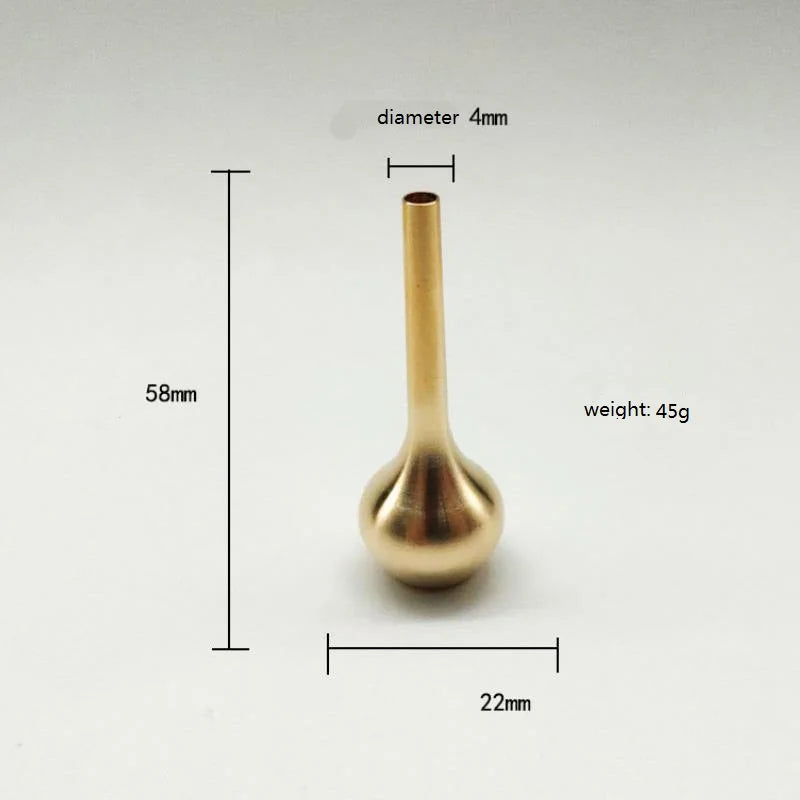 A sleek 58mm tall brass-colored mini vintage vase ornament made of pure copper for modern luxury home decoration