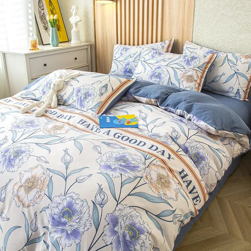 Purple and blue floral leaf print bedding set with cream background and navy edges featuring leaf print bedding design