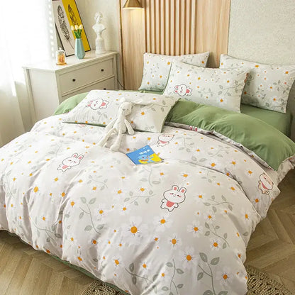 White duvet cover with playful bunny pattern and green vines paired with purple and blue leaf print bedding set
