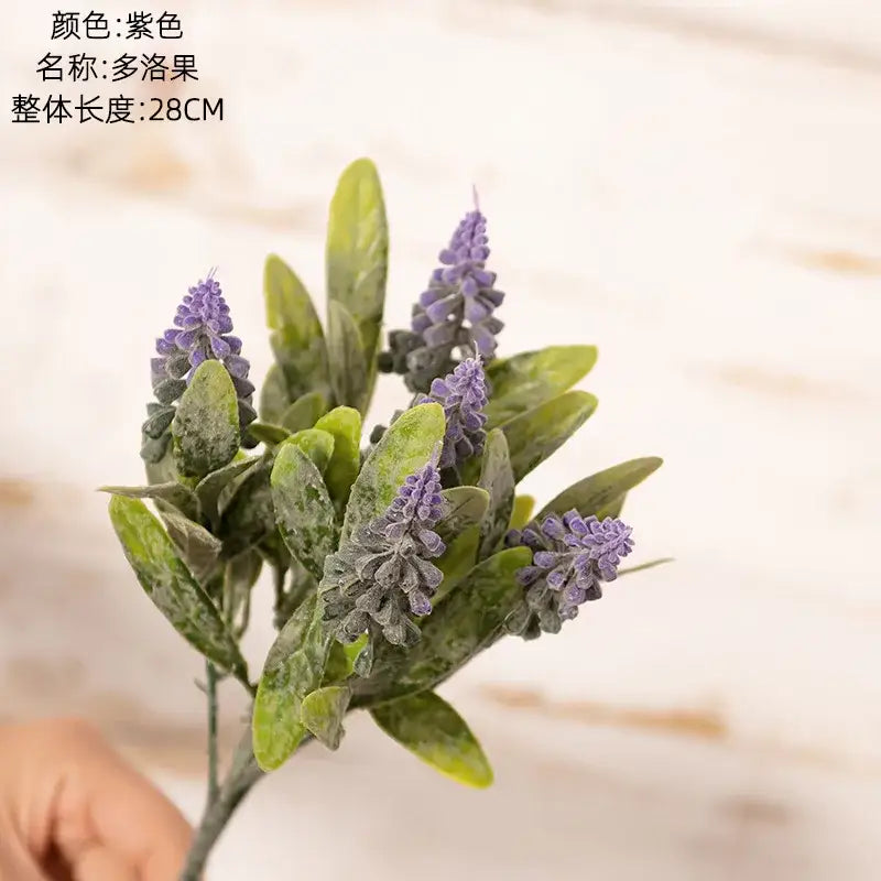 Purple and white lavender fake green plants bouquet with green leaves made of synthetic material for wedding decor