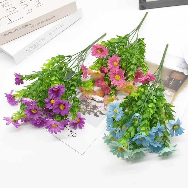 A vibrant pink purple and light blue artificial daisy bouquet green plant synthetic flowers for living room decor