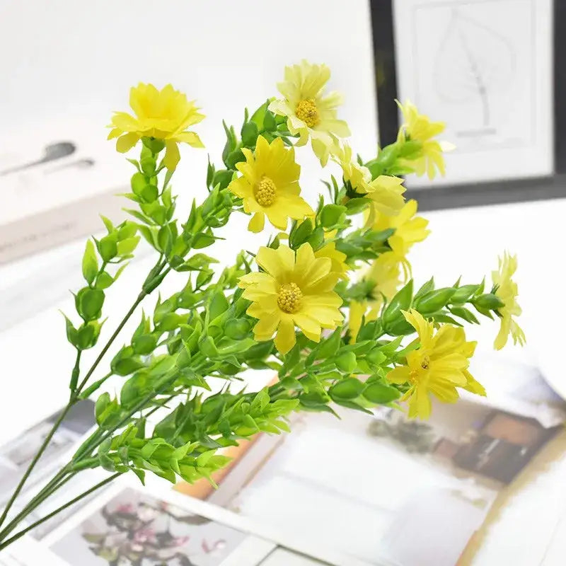 A vibrant yellow artificial daisy bouquet green with stems and leaves for living room synthetic flowers display